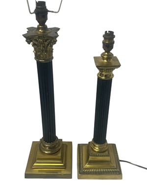 Lot 597 - TWO BRASS AND EBONISED TABLE LAMPS