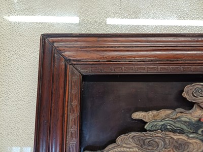 Lot 205 - λ A RARE CHINESE BONE AND IVORY-INLAID HONGMU AND ZITAN 'XIWANGMU' PANEL