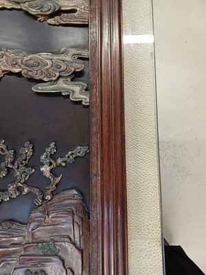 Lot 205 - λ A RARE CHINESE BONE AND IVORY-INLAID HONGMU AND ZITAN 'XIWANGMU' PANEL