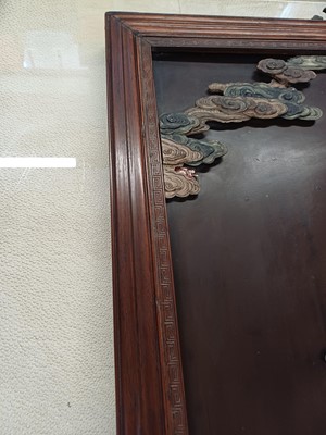 Lot 205 - λ A RARE CHINESE BONE AND IVORY-INLAID HONGMU AND ZITAN 'XIWANGMU' PANEL