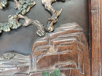 Lot 205 - λ A RARE CHINESE BONE AND IVORY-INLAID HONGMU AND ZITAN 'XIWANGMU' PANEL