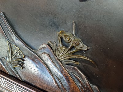 Lot 205 - λ A RARE CHINESE BONE AND IVORY-INLAID HONGMU AND ZITAN 'XIWANGMU' PANEL