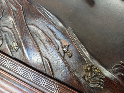 Lot 205 - λ A RARE CHINESE BONE AND IVORY-INLAID HONGMU AND ZITAN 'XIWANGMU' PANEL