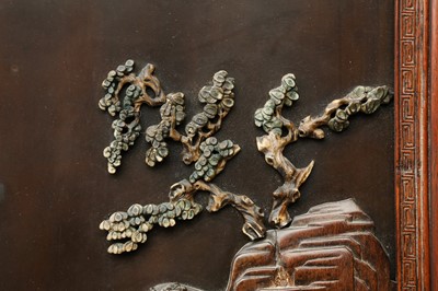 Lot 205 - λ A RARE CHINESE BONE AND IVORY-INLAID HONGMU AND ZITAN 'XIWANGMU' PANEL