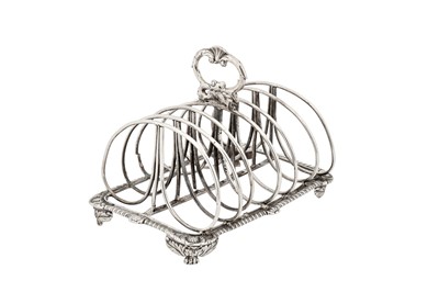 Lot 412 - A George III sterling silver seven bar toast rack, London 1818, maker’s mark obliterated