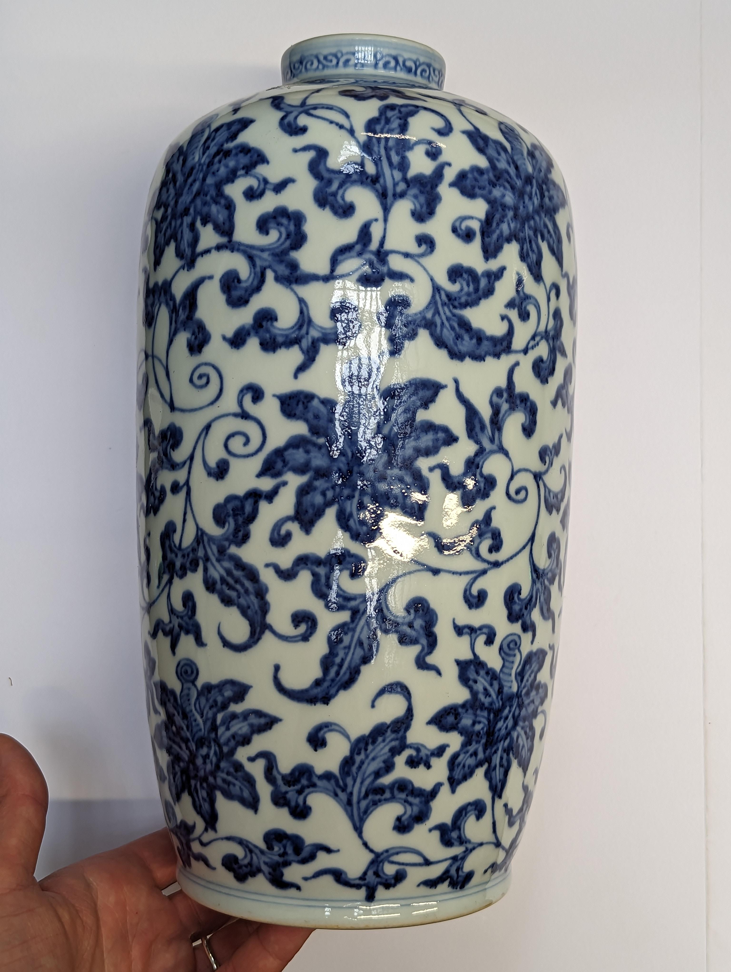 Lot 647 A CHINESE BLUE AND WHITE 'LILIES' VASE