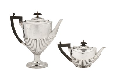 Lot 321 - A Victorian sterling silver coffee pot, London 1897 by William Hutton and Sons