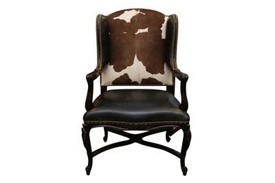 Lot 505 - A RALPH LAUREN LEATHER AND COW HIDE UPHOLSTERED WING BACK ARMCHAIR