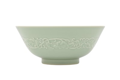 Lot 154 - A CHINESE CELADON-GLAZED MOULDED BOWL