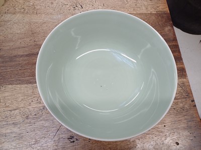 Lot 154 - A CHINESE CELADON-GLAZED MOULDED BOWL