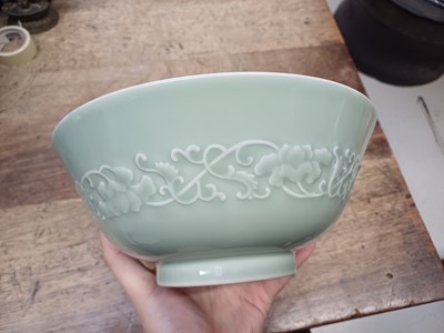 Lot 154 - A CHINESE CELADON-GLAZED MOULDED BOWL