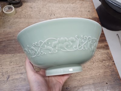 Lot 154 - A CHINESE CELADON-GLAZED MOULDED BOWL