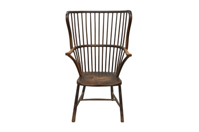 Lot 519 - AN EARLY 20TH CENTURY STAINED BEECH AND ASH WING BACK WINDSOR ARMCHAIR