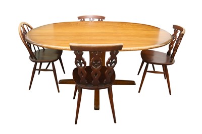 Lot 415 - AN ERCOL ELM OVAL DINING TABLE