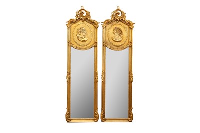 Lot 446 - A PAIR OF ROCOCO STYLE GILDED LONG NARROW MIRRORS