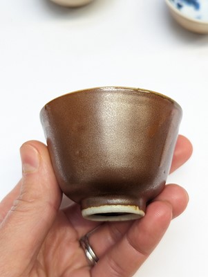 Lot 40 - THREE CHINESE BROWN-GLAZED CUPS