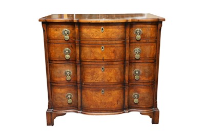 Lot 522 - A FEATHERBANDED WALNUT SERPENTINE CHEST OF DRAWERS