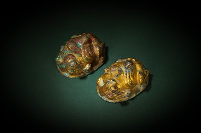 Lot 238 - A PAIR OF CHINESE GILT-BRONZE 'CAMEL' MAT WEIGHTS