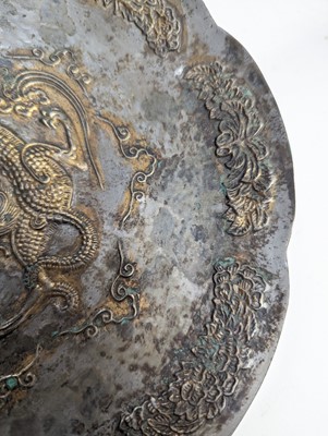 Lot 242 - A CHINESE PARCEL-GILT SILVERED COPPER-ALLOY 'DRAGON' DISH