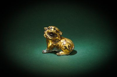 Lot 229 - A CHINESE GILT-BRONZE FIGURE OF A LION