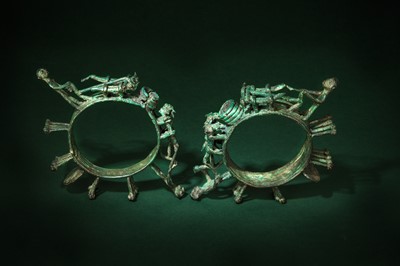 Lot 242 - A PAIR OF DONG SON BRONZE 'AGRICULTURE' FITTINGS