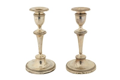 Lot 202 - A PAIR OF GEORGE V STERLING SILVER CANDLESTICKS, BIRMINGHAM 1910 BY I. S GREENBERG