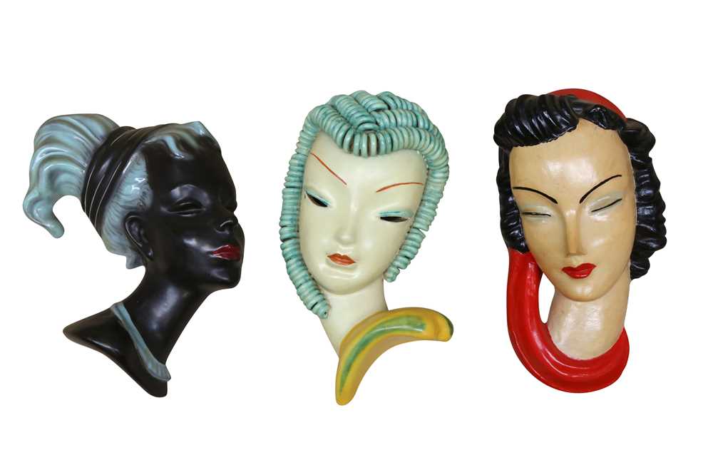 Lot 166 A GROUP OF PAINTED PLASTER WALL HANGING