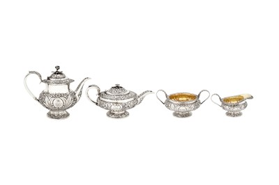 Lot 387 - A matched George IV sterling silver four-piece tea and coffee service, London 1823/25 by William Hunter II