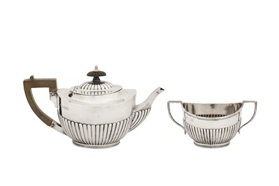 Lot 329 - An Edwardian sterling silver teapot and sugar bowl, Chester 1906 by Barker Brothers