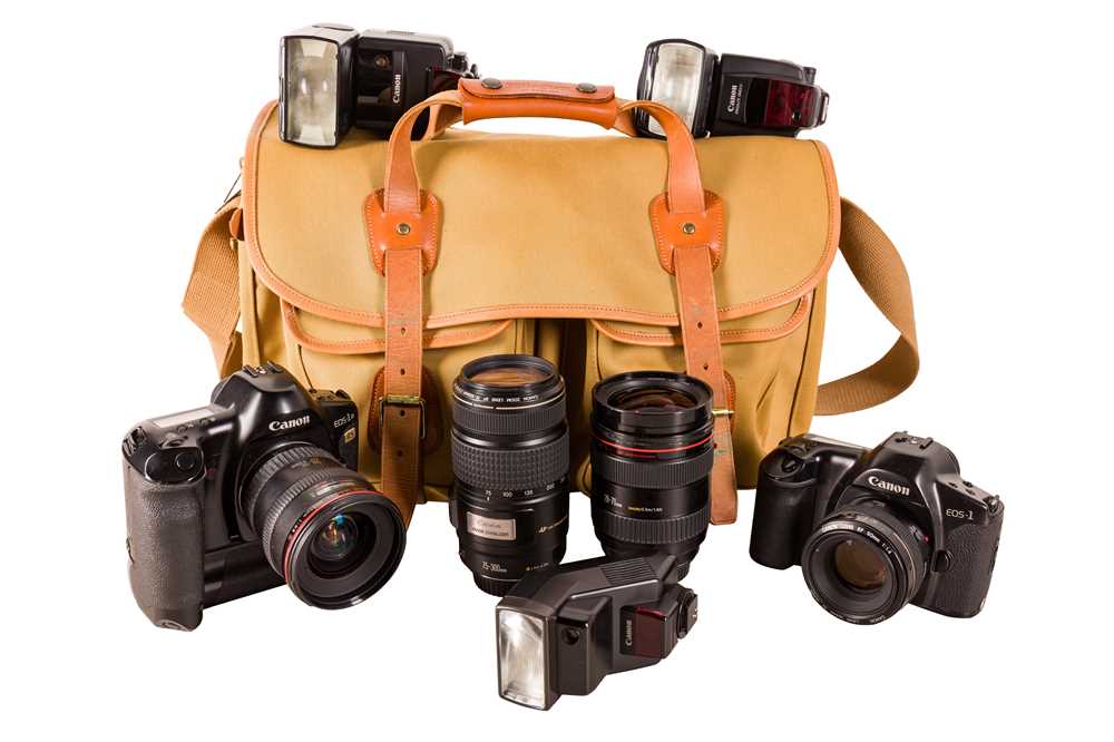 Lot 1020 - A PAIR OF CANON EOS 1 SLR OUTFITS WITH ACCESSORIES.