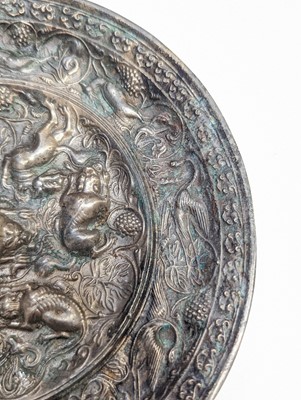 Lot 221 - A CHINESE SILVERED BRONZE 'LION AND GRAPEVINE' MIRROR