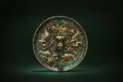 Lot 233 - A SMALL CHINESE BRONZE 'LION' MIRROR