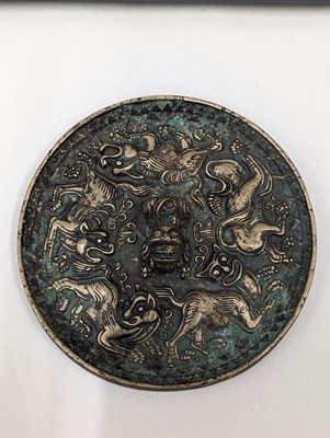 Lot 252 - A SMALL CHINESE BRONZE 'LION' MIRROR