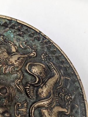 Lot 252 - A SMALL CHINESE BRONZE 'LION' MIRROR