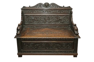 Lot 427 - A 19TH CENTURY CARVED HALL SETTLE