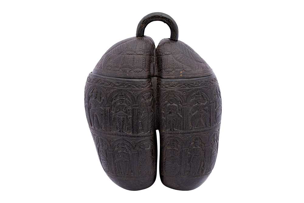 Lot 263 - A CARVED COCO-DE-MER (LODOICEA MALDIVICA) WITH FIGURAL MOTIFS