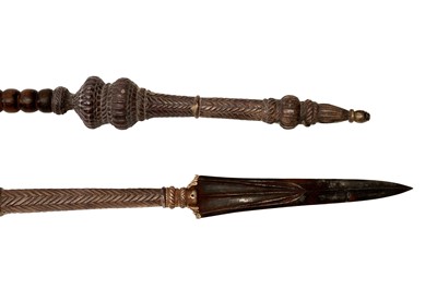 Lot 219 - AN IMPRESSIVE PAIR OF SILVER-MOUNTED WOODEN TEMPLE GUARDIANS (DVARAPALAS) SPEARS