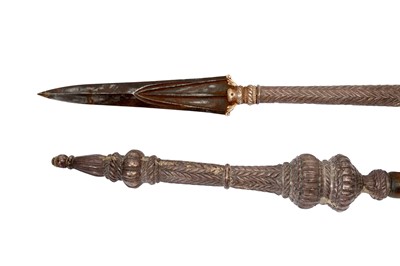 Lot 219 - AN IMPRESSIVE PAIR OF SILVER-MOUNTED WOODEN TEMPLE GUARDIANS (DVARAPALAS) SPEARS