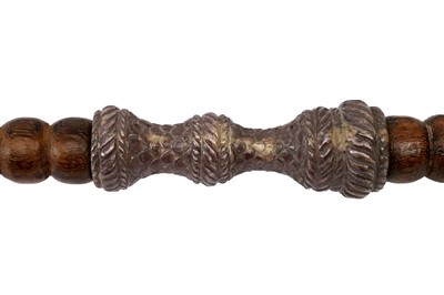 Lot 219 - AN IMPRESSIVE PAIR OF SILVER-MOUNTED WOODEN TEMPLE GUARDIANS (DVARAPALAS) SPEARS