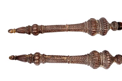 Lot 219 - AN IMPRESSIVE PAIR OF SILVER-MOUNTED WOODEN TEMPLE GUARDIANS (DVARAPALAS) SPEARS