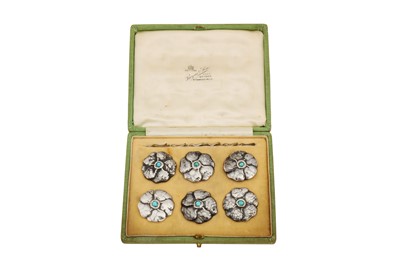 Lot 256 - A cased set of six Edwardian 'Arts and Crafts’ sterling silver and turquoise buttons, Birmingham 1903 by Liberty