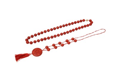 Lot 587 - TWO CHINESE CARVED CINNABAR LACQUER BEAD NECKLACES