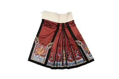 Lot 27 - A CHINESE EMBROIDERED AUBERGINE-GROUND SILK 'DRAGON AND PHOENIX' SKIRT