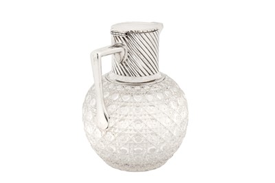Lot 349 - A Victorian sterling silver mounted glass claret jug, London 1890 by Rupert Favell and Henry Elliott