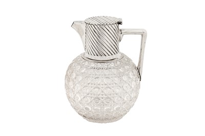 Lot 349 - A Victorian sterling silver mounted glass claret jug, London 1890 by Rupert Favell and Henry Elliott
