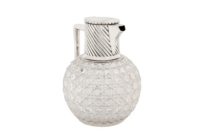 Lot 349 - A Victorian sterling silver mounted glass claret jug, London 1890 by Rupert Favell and Henry Elliott