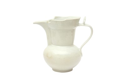 Lot 855 - A CHINESE MONOCHROME WHITE-GLAZED 'MONK'S CAP' EWER