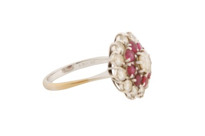 Lot 37 - A DIAMOND AND RUBY CLUSTER RING