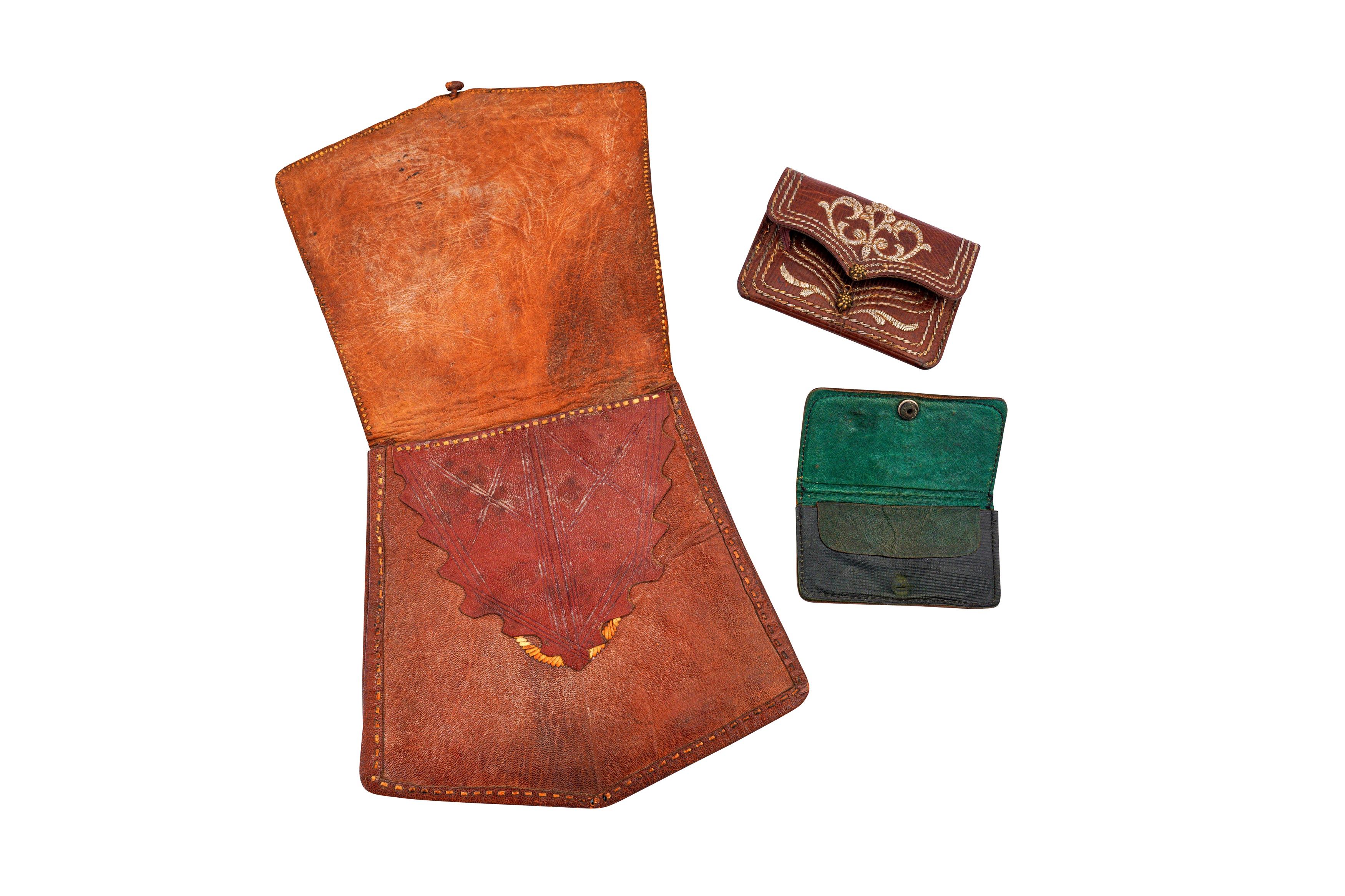 Lot 381 - TWO METAL THREAD-EMBROIDERED LEATHER WALLETS