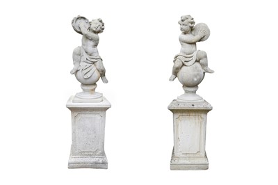 Lot 30 - A PAIR OF COMPOSITION STONE MUSICAL PUTTI